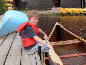 Junior boy with canoe