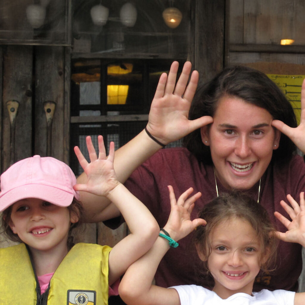 camp arowhon staff members makes faces at camera with campers
