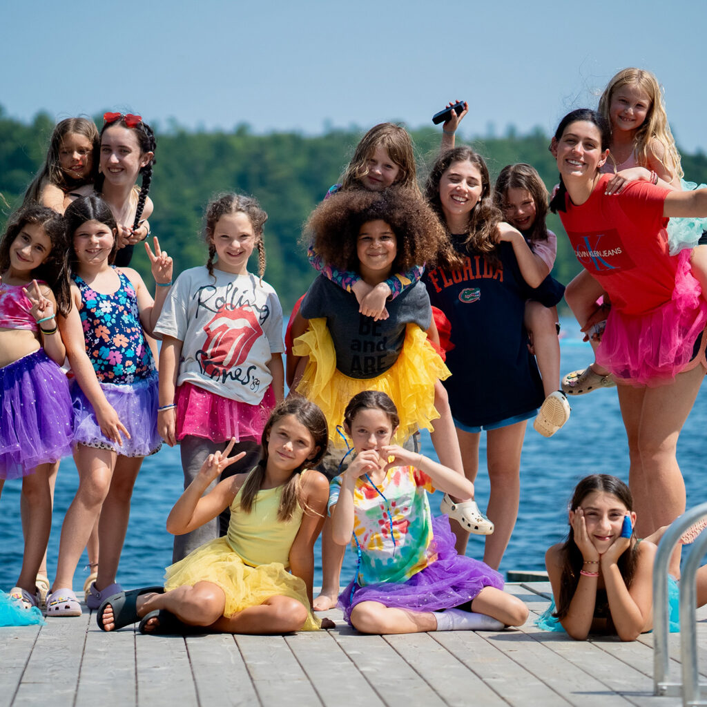 campers posting on boardwalk at camp arowhon