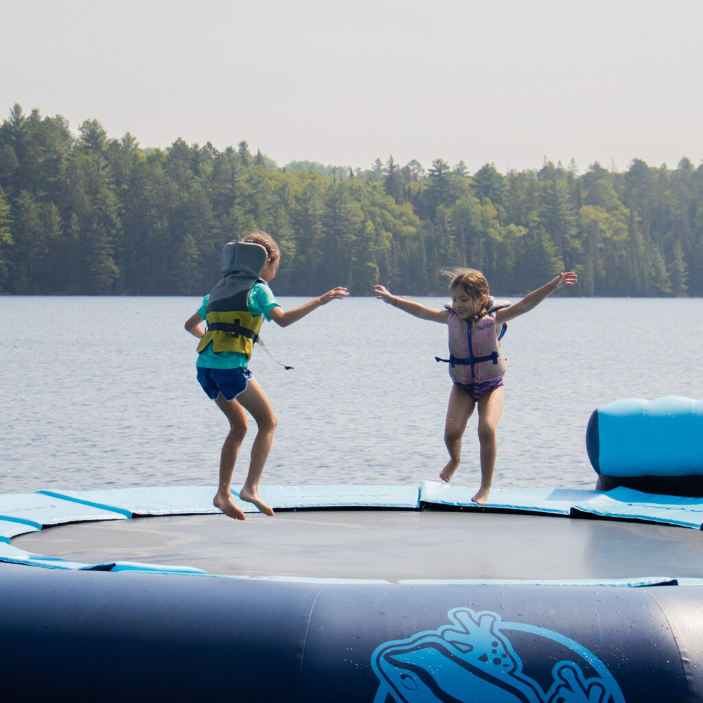 campers enjoying jumping on trampoline at camp arowhon